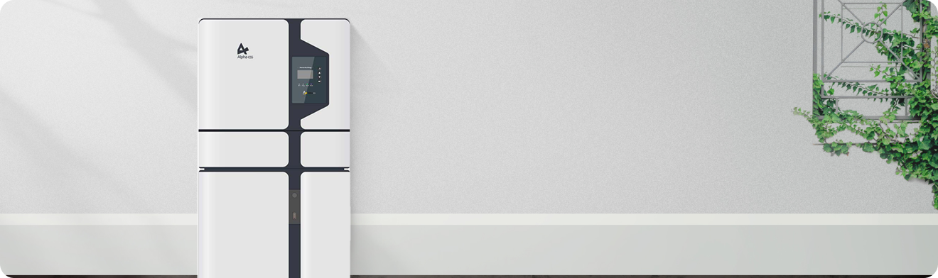 A two-tone white and gray Alpha ess home battery storage unit installed on a modern exterior wall