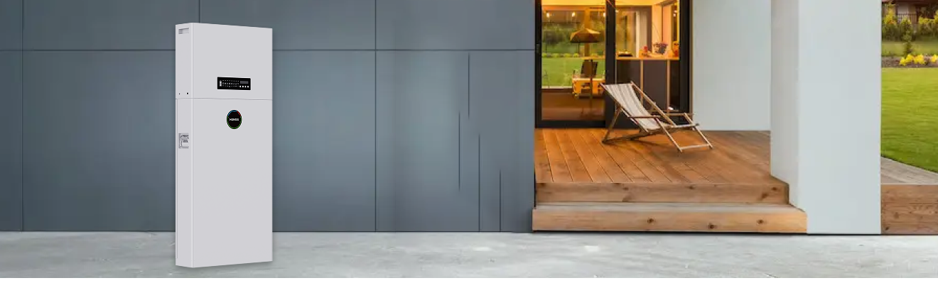 A two-tone white and gray Alpha ess home battery storage unit installed on a modern exterior wall