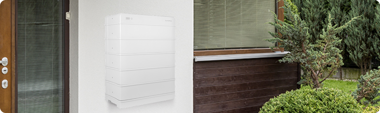 White home battery storage unit on a house wall